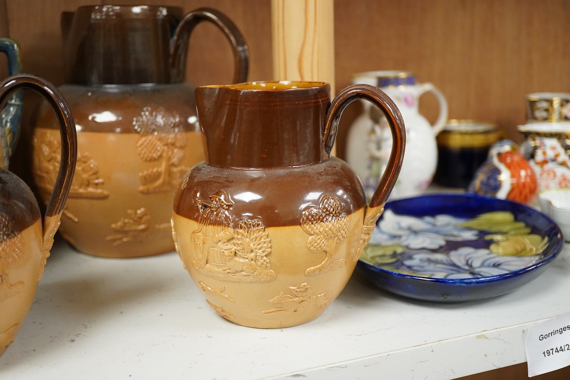Four graduated Royal Doulton harvest jugs and a Royal Doulton Lambeth three footed jardiniere- 17cm high
